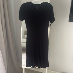 NWT black fitted knit dress with slight ruffle at hem